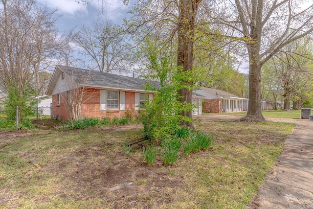 3210 Kingsbury St, Jonesboro, AR 72401 - view of side of home with brick siding