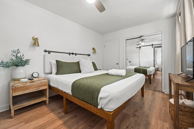 bedroom featuring baseboards, ceiling fan, and wood finished floors