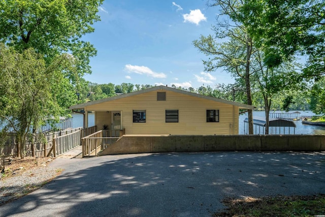 view of home's exterior with fence