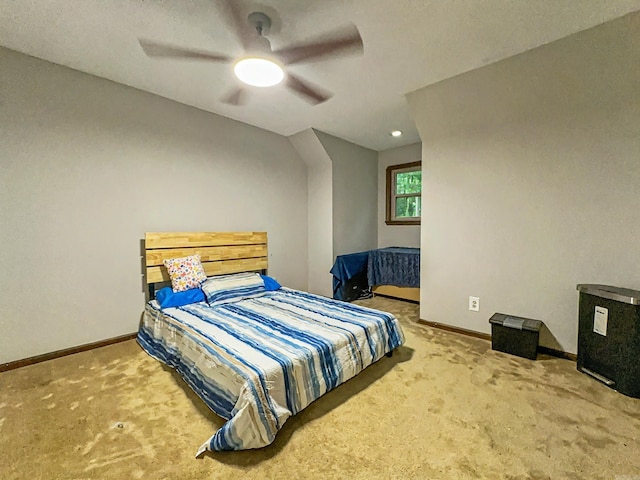 carpeted bedroom featuring baseboards and a ceiling fan