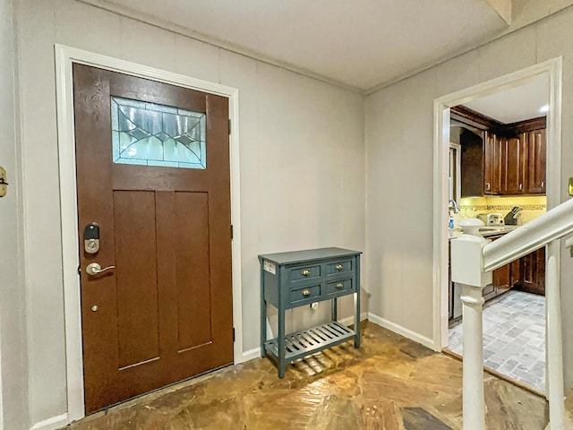 entryway featuring baseboards