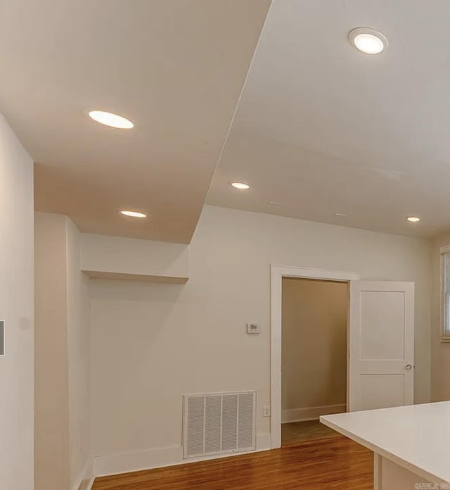 interior space with visible vents, recessed lighting, baseboards, and wood finished floors