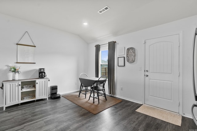 dining area with visible vents, dark wood finished floors, baseboards, lofted ceiling, and recessed lighting