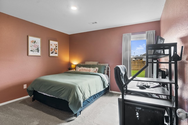 carpeted bedroom with baseboards and visible vents