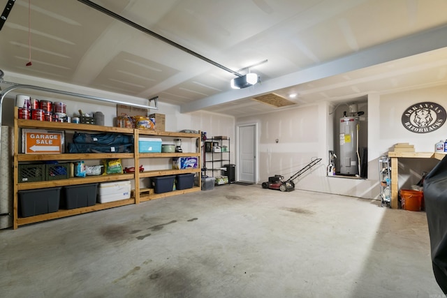 garage with a garage door opener and electric water heater