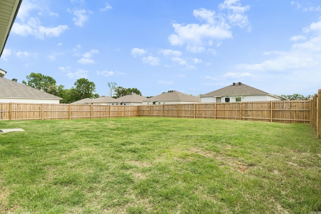 view of yard featuring a fenced backyard