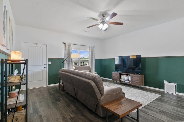 living room with baseboards, a ceiling fan, dark wood-style floors, and visible vents