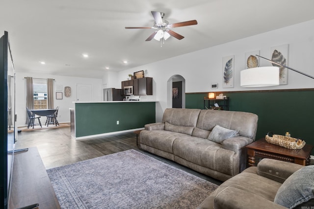 living room featuring recessed lighting, arched walkways, ceiling fan, and wood finished floors
