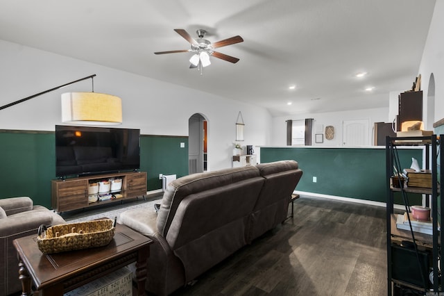 living area with recessed lighting, arched walkways, ceiling fan, and dark wood-style floors
