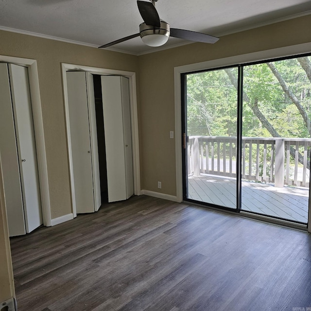 unfurnished bedroom with baseboards, ornamental molding, access to exterior, and wood finished floors