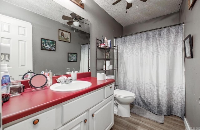 6322 US Highway 278, Rosston, AR 71858 - full bathroom featuring a ceiling fan, a textured ceiling, wood finished floors, vanity, and toilet
