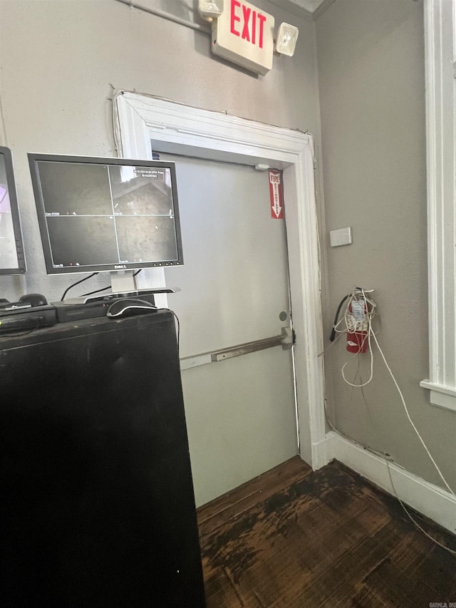 laundry area featuring dark wood-style flooring