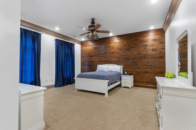 bedroom with light colored carpet, ornamental molding, recessed lighting, wooden walls, and a ceiling fan