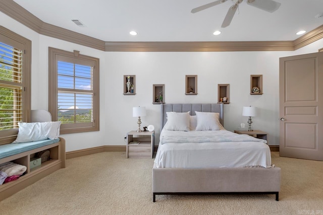 carpeted bedroom featuring ornamental molding, baseboards, visible vents, and multiple windows