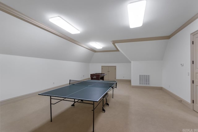 game room with visible vents, baseboards, lofted ceiling, and light carpet