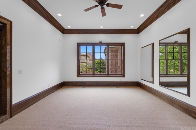 carpeted empty room featuring baseboards, recessed lighting, ornamental molding, and ceiling fan
