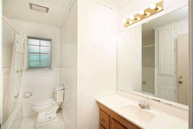 full bath with toilet, vanity, a textured ceiling, visible vents, and crown molding