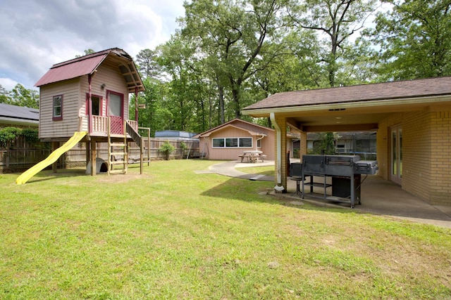 view of yard featuring a patio area and fence