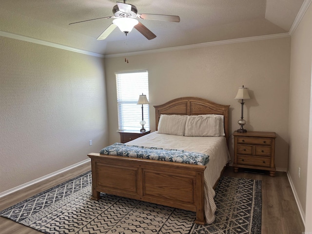 bedroom with baseboards, ornamental molding, light wood-style flooring, and a ceiling fan