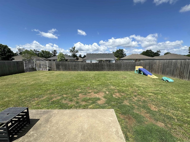view of yard featuring a patio and a fenced backyard