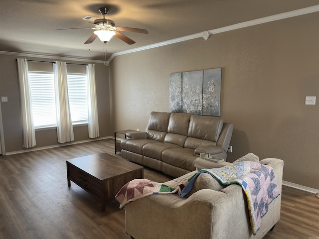 living area with a ceiling fan, baseboards, crown molding, wood finished floors, and a textured wall
