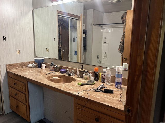 full bathroom featuring vanity and a shower stall