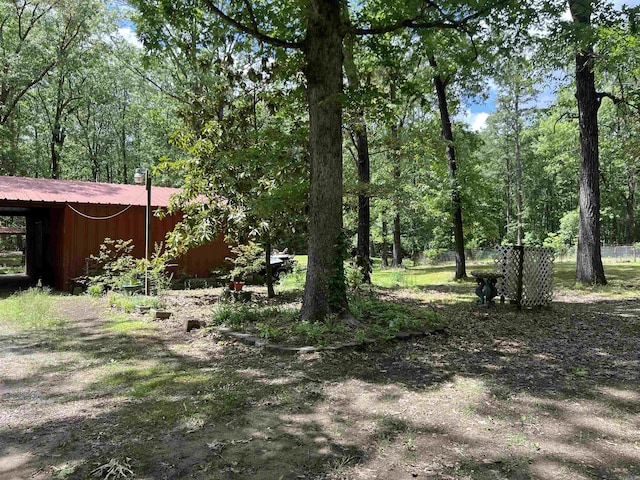 view of yard with an outbuilding and a pole building