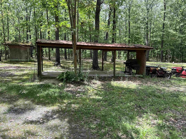 view of community featuring a wooded view