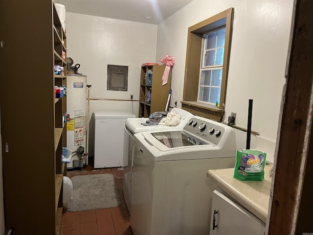 laundry room with washer and clothes dryer, electric panel, laundry area, water heater, and tile patterned floors