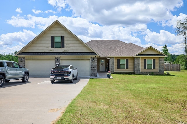 craftsman-style home with fence, a front lawn, concrete driveway, a shingled roof, and brick siding