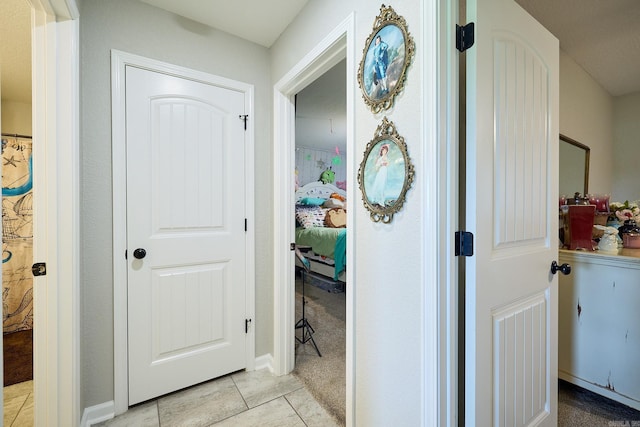 corridor featuring light tile patterned flooring
