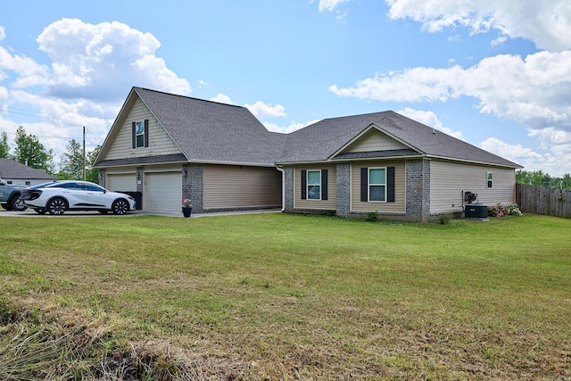 view of front of house with fence, a garage, central AC, a front yard, and roof with shingles