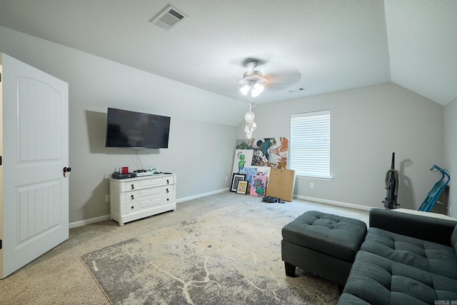 interior space with a ceiling fan, visible vents, baseboards, and lofted ceiling