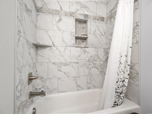 bathroom with shower / bathtub combination with curtain