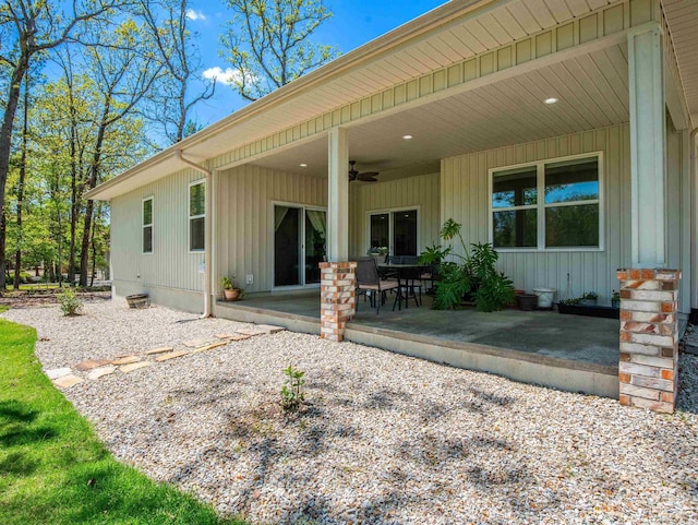 rear view of property featuring a patio area and ceiling fan