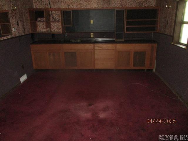 kitchen with dark countertops
