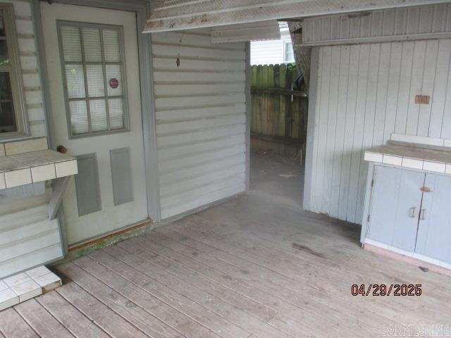 exterior space with a wooden deck and fence