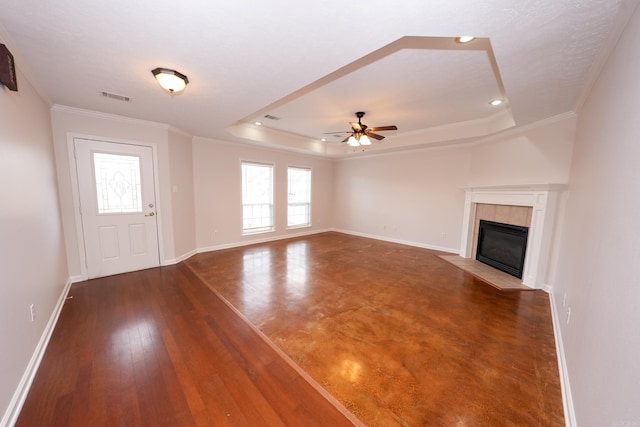 unfurnished living room featuring crown molding, visible vents, baseboards, and ceiling fan