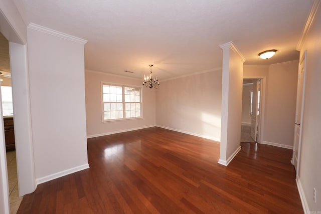 unfurnished room featuring baseboards, dark wood-style flooring, a notable chandelier, and crown molding
