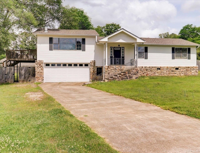 view of front of home with concrete driveway, an attached garage, a front lawn, and a shingled roof