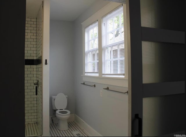 315 W 22nd St, Little Rock, AR 72206 - full bathroom featuring a shower stall, tile patterned flooring, baseboards, and toilet