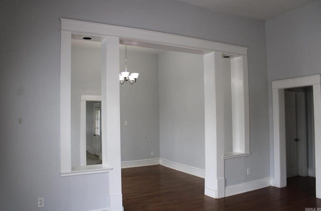 315 W 22nd St, Little Rock, AR 72206 - unfurnished dining area with an inviting chandelier, wood finished floors, and baseboards