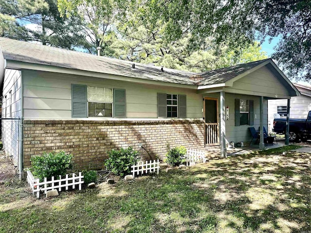 3120 Race St, Jonesboro, AR 72401 - single story home with brick siding, a shingled roof, and fence
