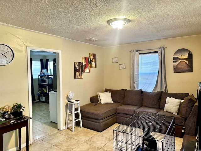 3120 Race St, Jonesboro, AR 72401 - living area with ornamental molding, a textured ceiling, light tile patterned floors, and visible vents