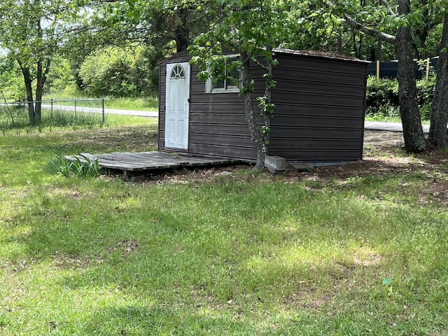 view of shed with fence
