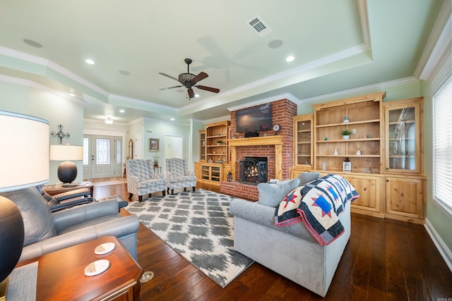 199 Gleneagle Loop, Hot Springs, AR 71913 - living area featuring dark wood finished floors, visible vents, a raised ceiling, and ceiling fan