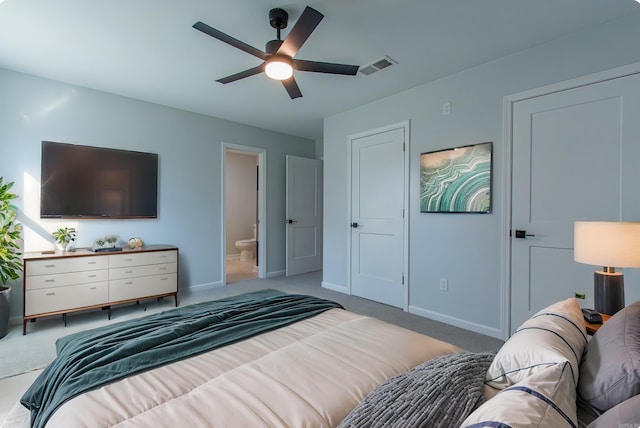 bedroom featuring visible vents, baseboards, and light carpet