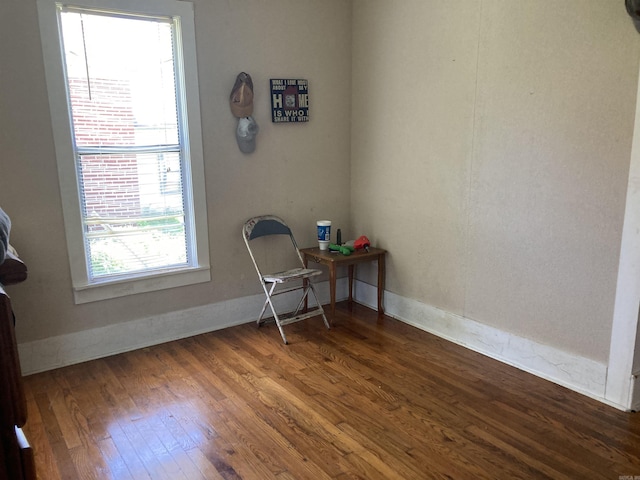 207 11th St, Mena, AR 71953 - living area with wood finished floors and baseboards