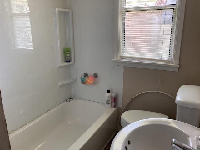 207 11th St, Mena, AR 71953 - full bathroom with a sink, toilet, and a tub
