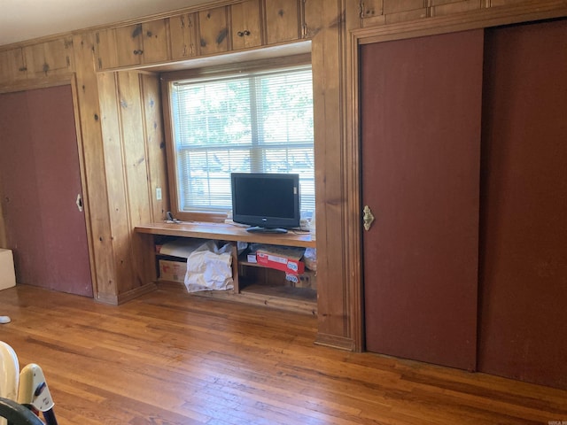 207 11th St, Mena, AR 71953 - office space featuring light wood finished floors and wood walls